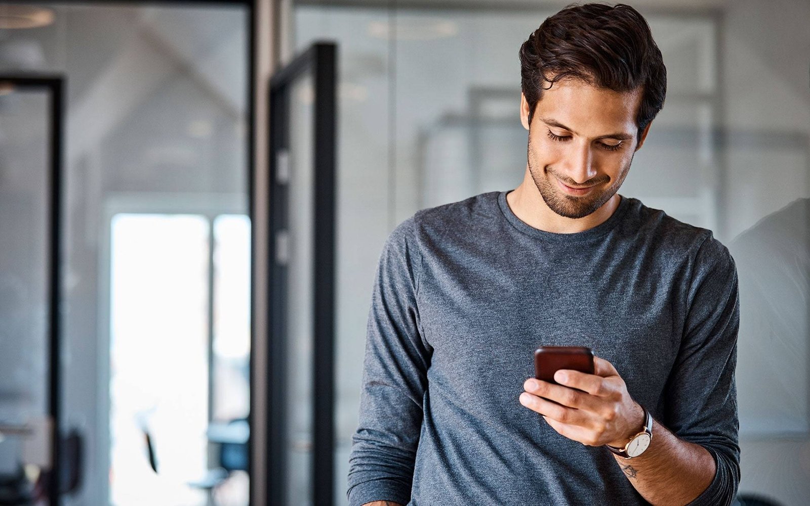 man grey top phone