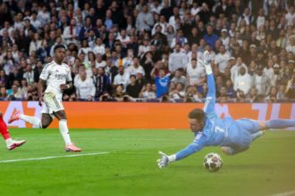 Real Madrid survive Benfica scare to reach last 16