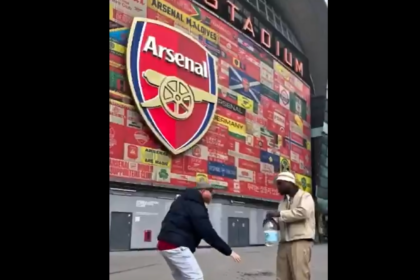 Tunde Perry sprays Zamzam water at Emirates Stadium in symbolic prayer for Arsenal Champions League success