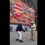 Tunde Perry sprays Zamzam water at Emirates Stadium in symbolic prayer for Arsenal Champions League success