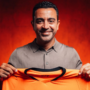 Xavi Hernández poses after signing a four-year contract as the new head coach of the Netherlands.
